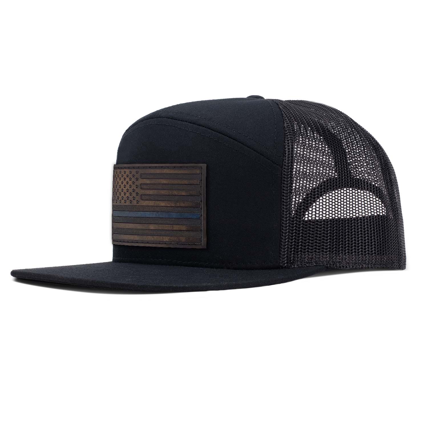 Revolution Mfg all black 7 panel trucker featuring our Thin Blue Line American Flag full grain leather patch on the seamless front panel