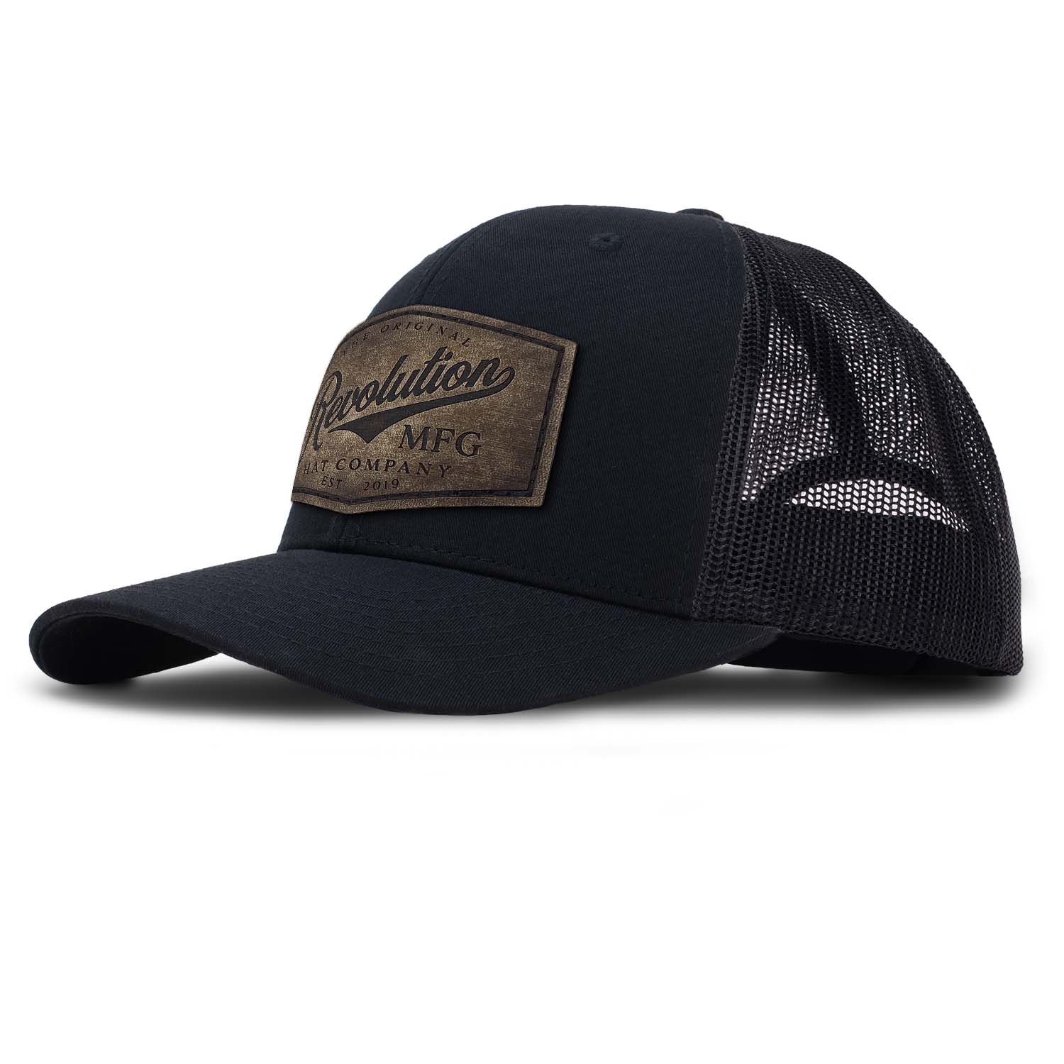 Revolution Hat Co full grain leather patch in a vintage finish on a black with black mesh classic trucker hat