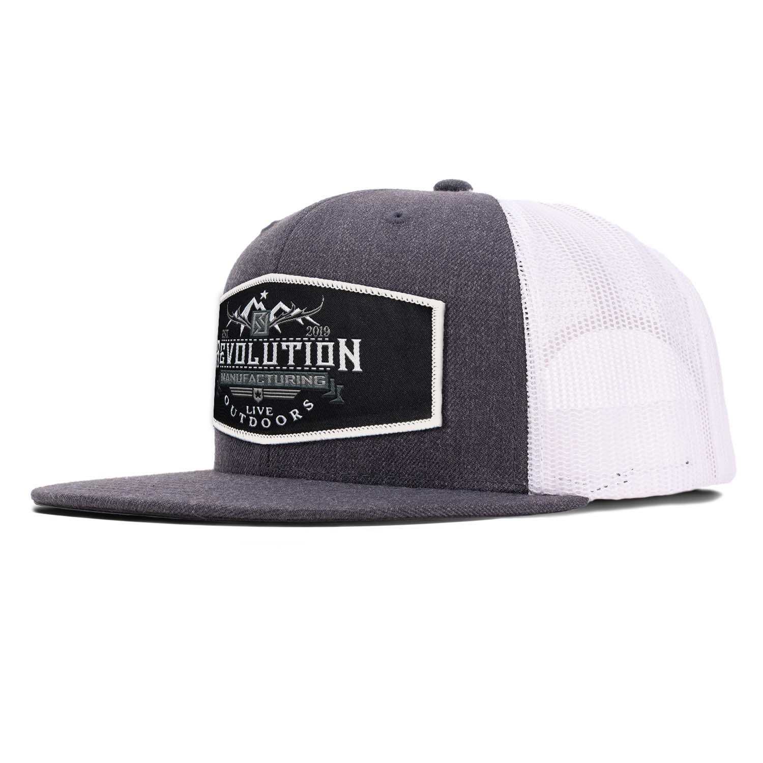 Classic flat bill trucker hat in charcoal with white mesh with a black with white border Revolution Mfg Live Outdoors woven patch