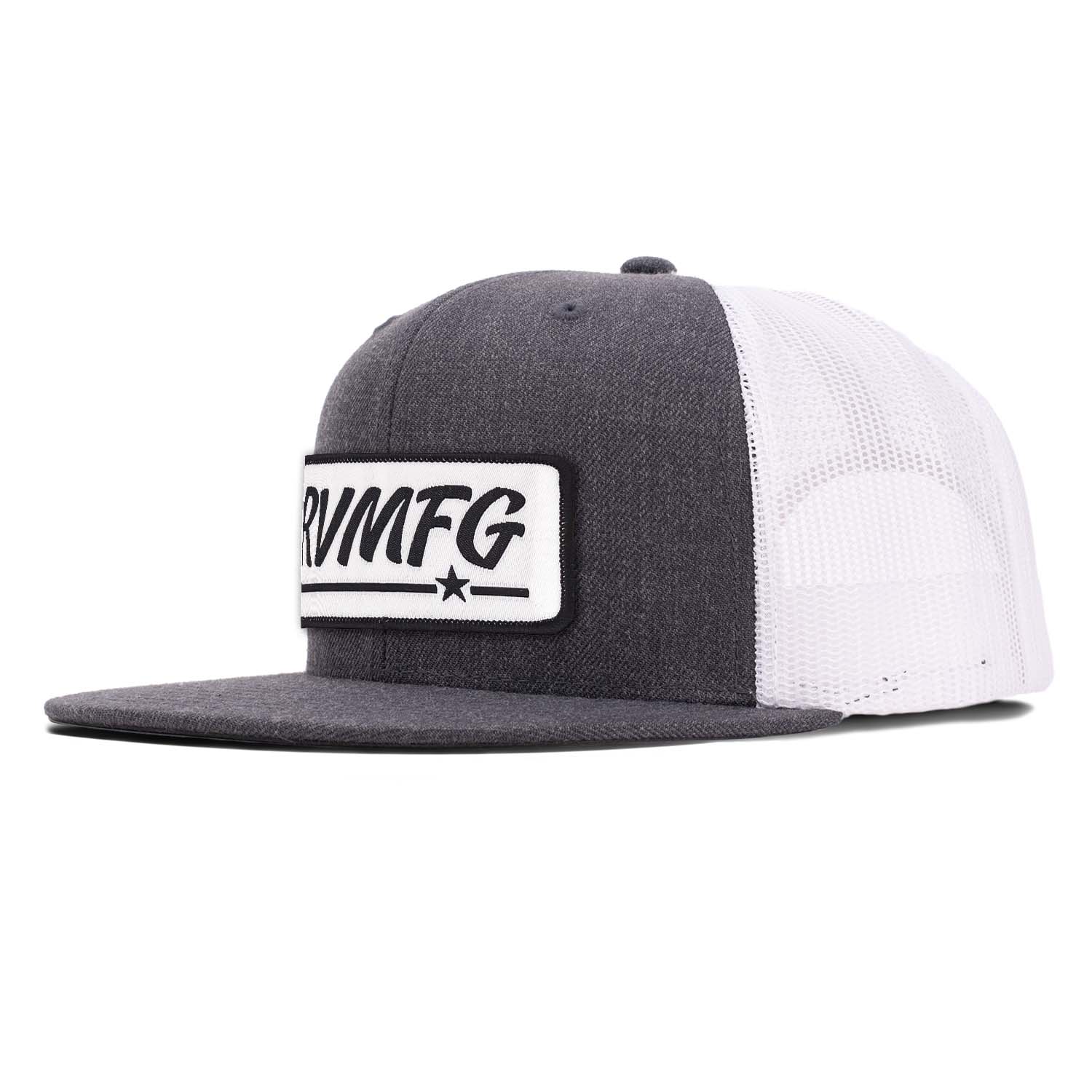 Revolution Mfg flat bill trucker hat in charcoal with white mesh with a white woven RVMFG patch with black letters and a black border