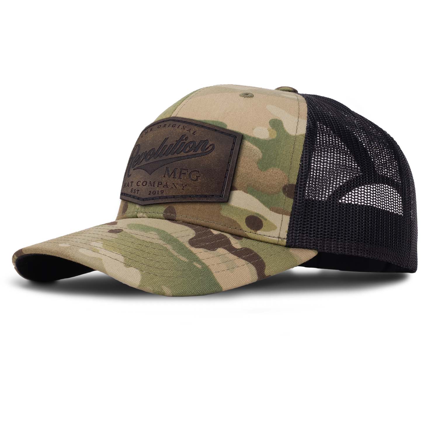 Revolution Mfg Hat Co full grain leather patch on a classic multicam camo trucker hat with black mesh