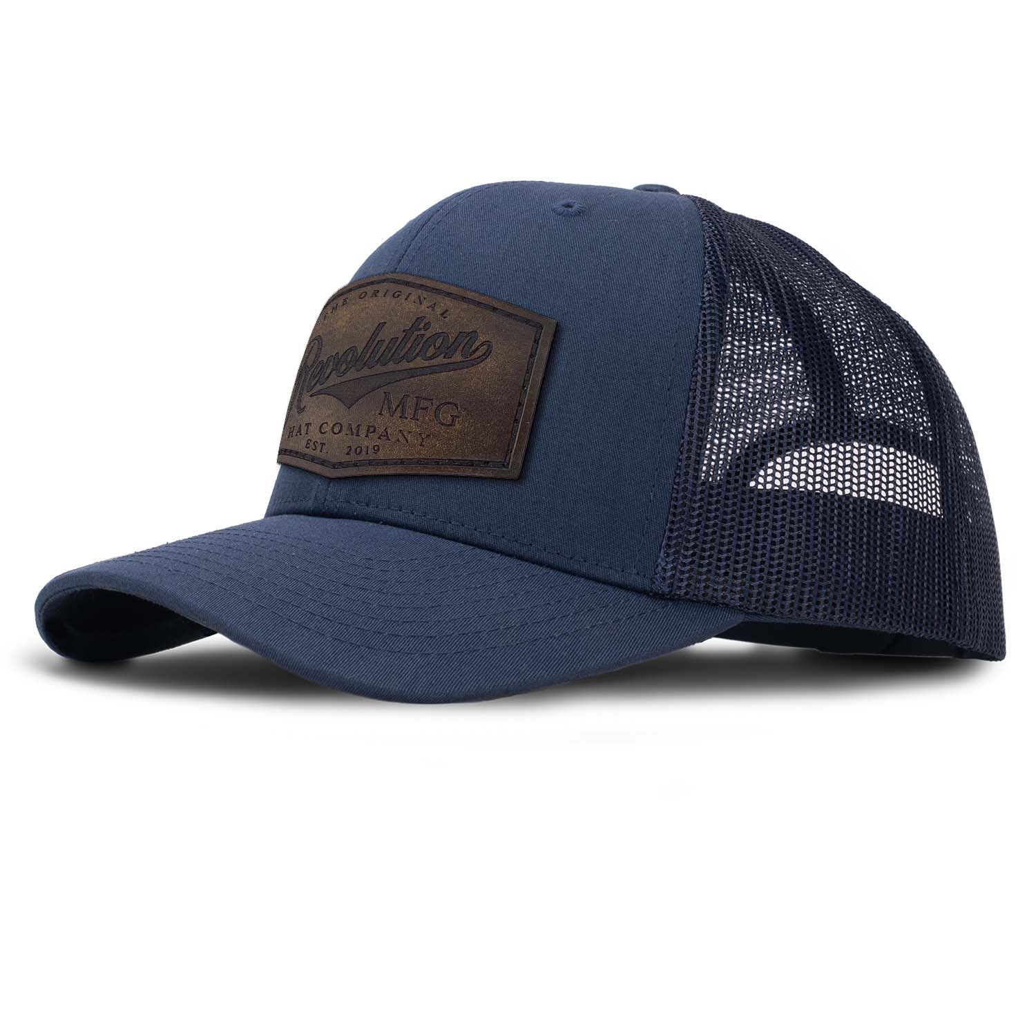 Revolution Mfg Hat Co full grain leather patch on a classic navy trucker hat with navy mesh