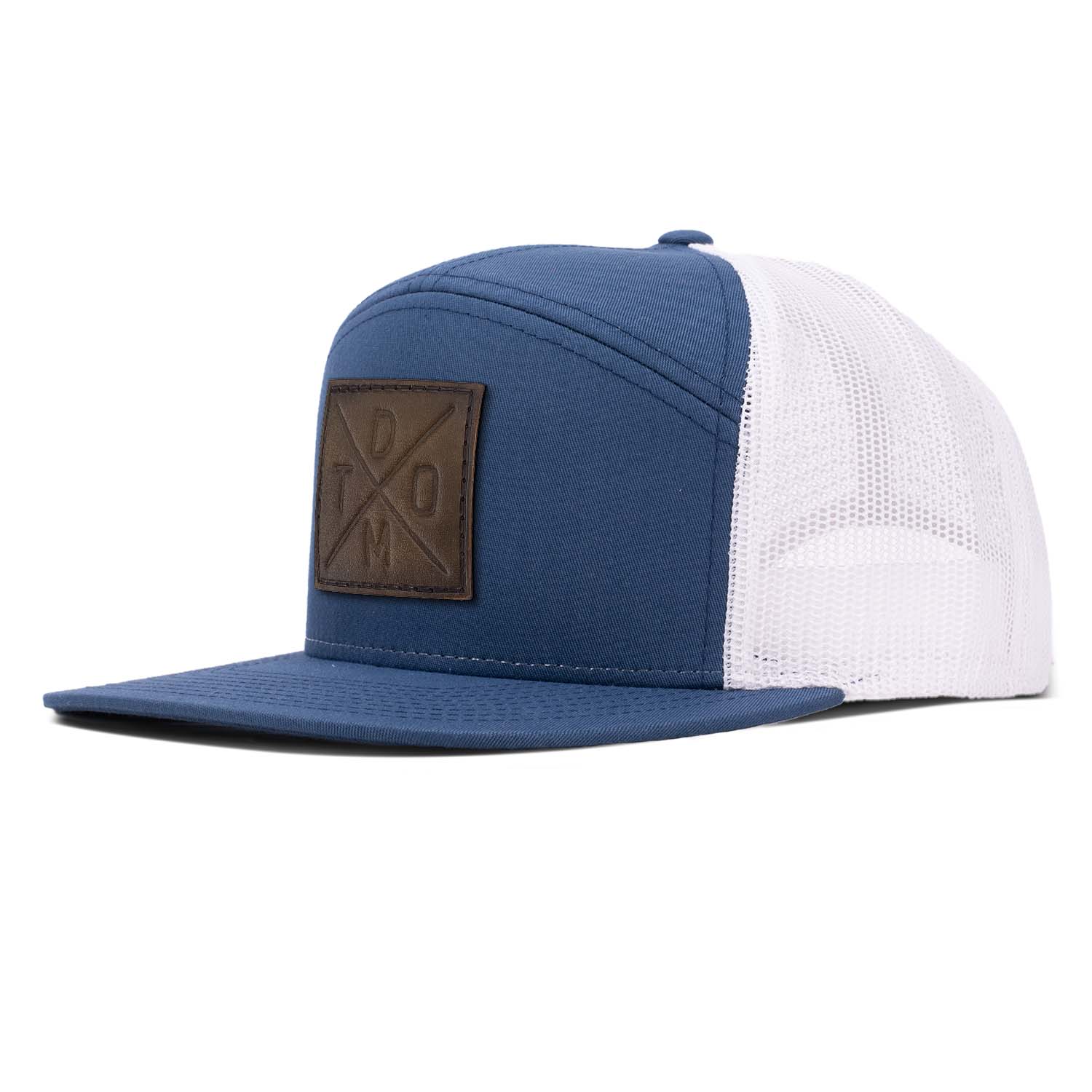 Revolution Mfg navy with white mesh 7 panel trucker featuring our original DTOM debossed full grain leather patch.