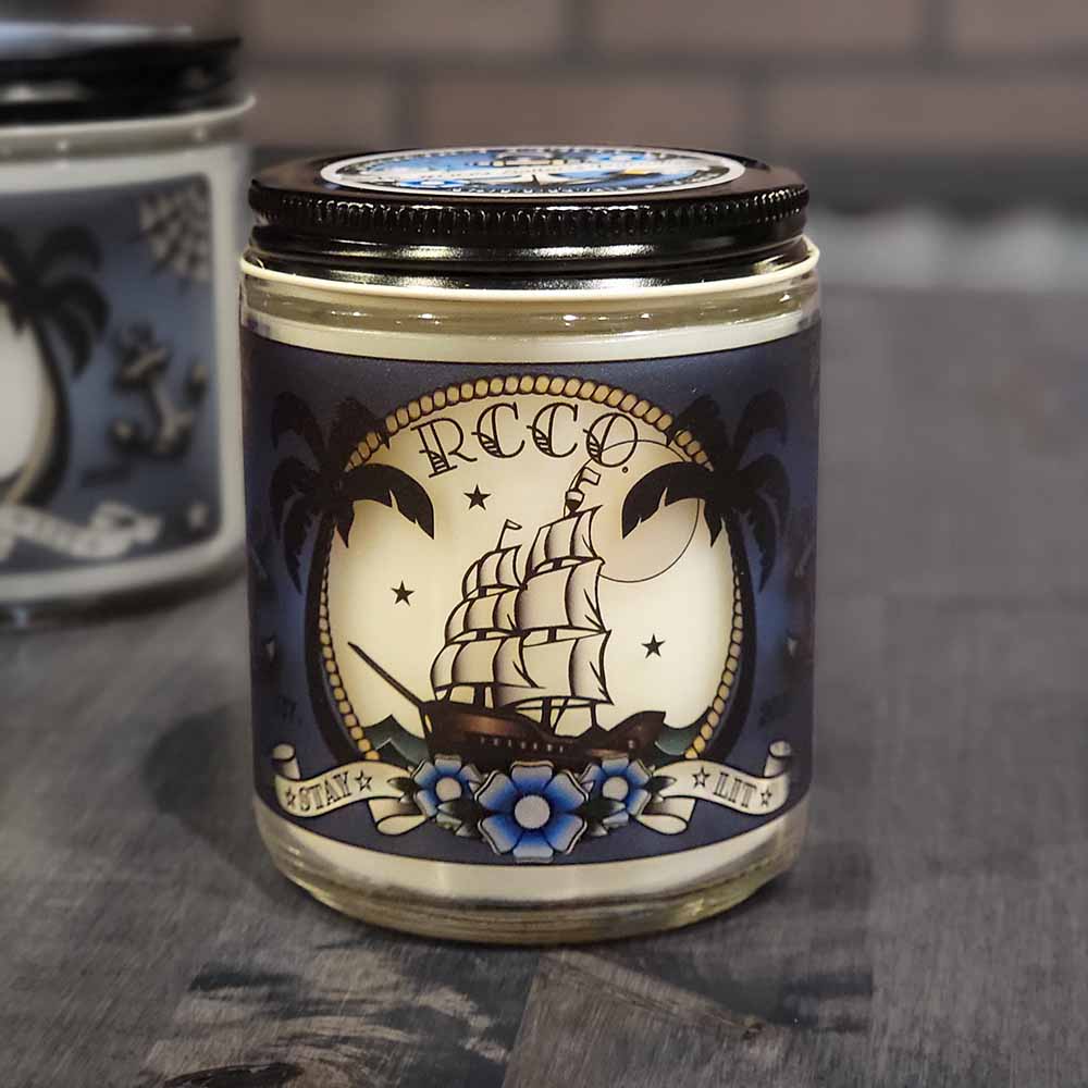 American Made Traditional Tattoo-inspired designs Sailor's Paradise tropical scent Soy blend candle Revolution Candle Co Palm trees Blue Flowers Ship Sailing under moon and stars Old School anchors