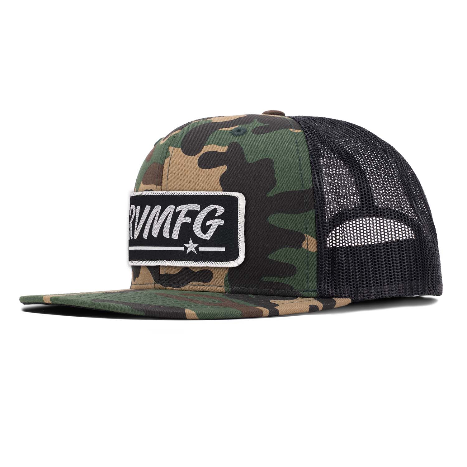 Revolution Mfg flat bill trucker hat in woodland camo with black mesh with a black RVMFG woven patch with white letters and a white border