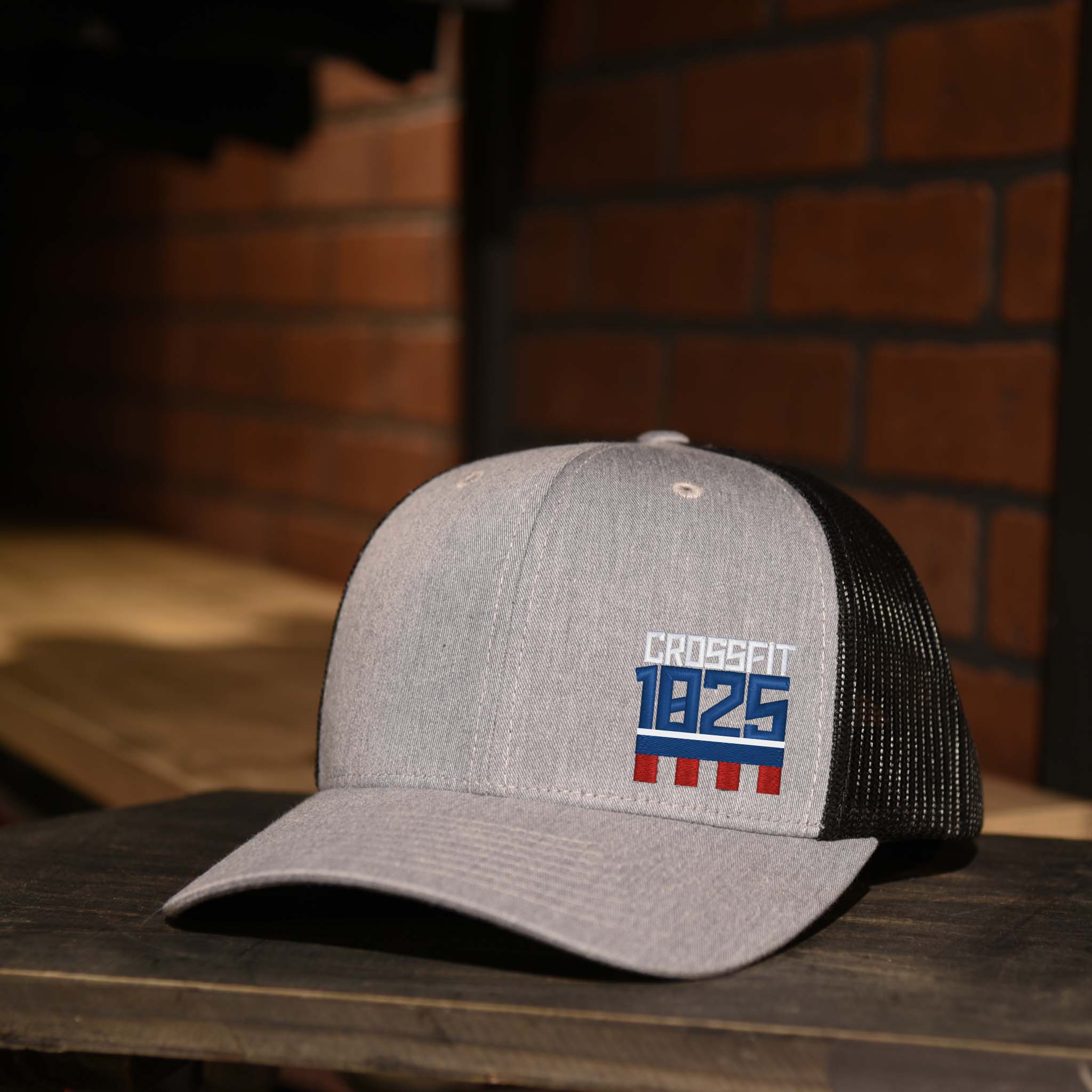CrossFit 1825 Heather Gray & Black Trucker Hat with Red, White, and Blue Embroidered Logo