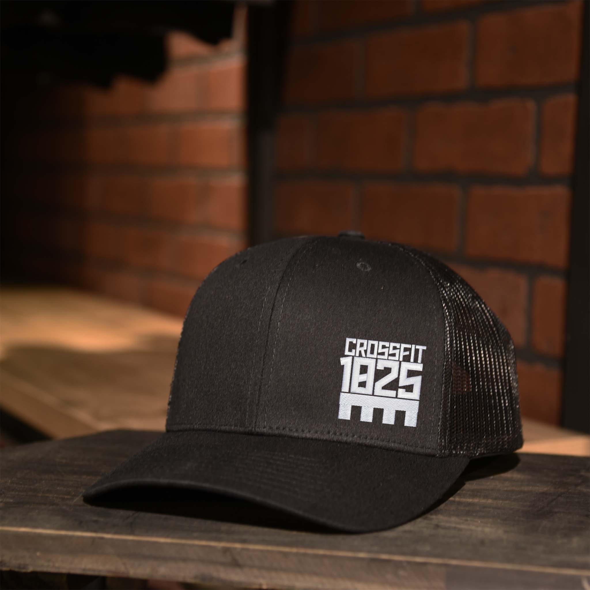 CrossFit 1825 White Embroidered Logo Trucker Hat in all Black
