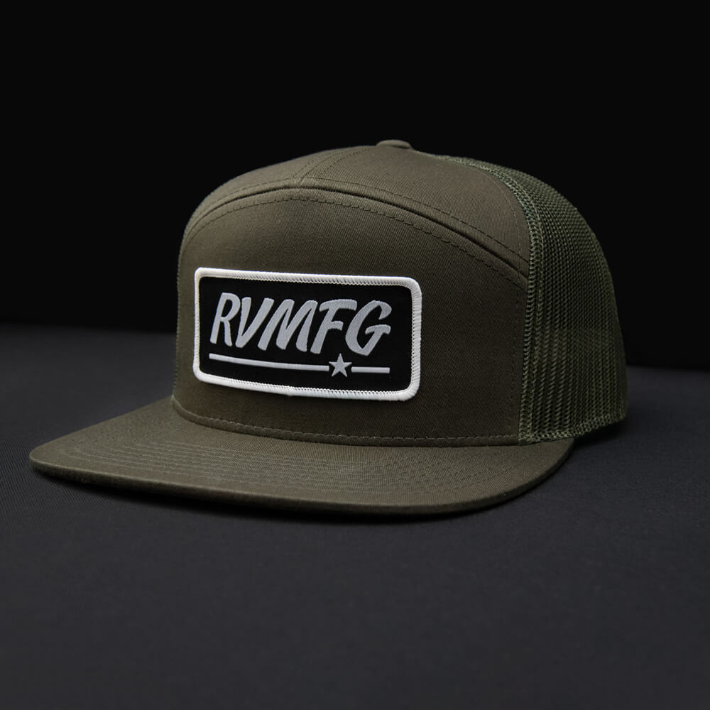 RVMFG Loden 7 panel flat bill trucker hat with black woven patch