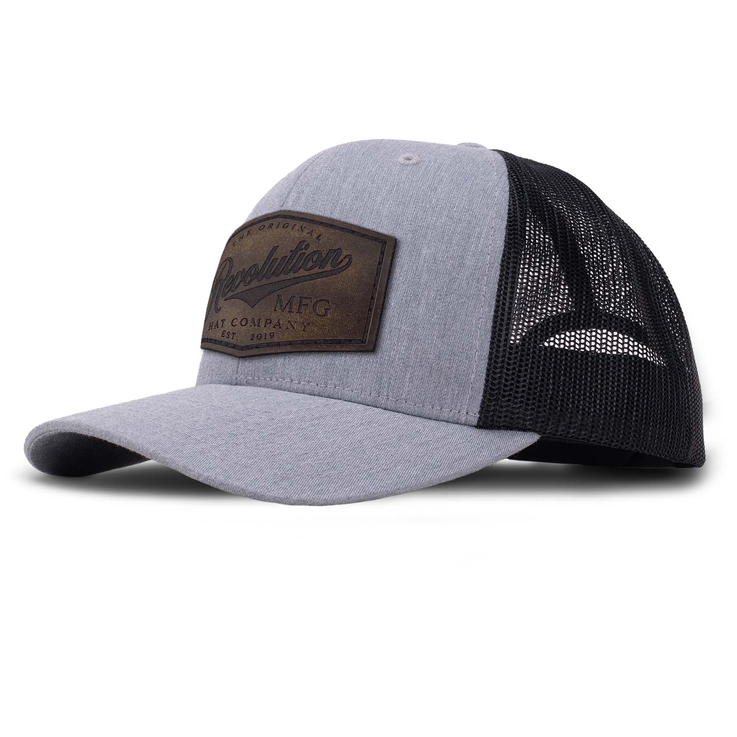 Revolution Mfg Hat Co full grain leather patch on a classic heather gray trucker hat with black mesh