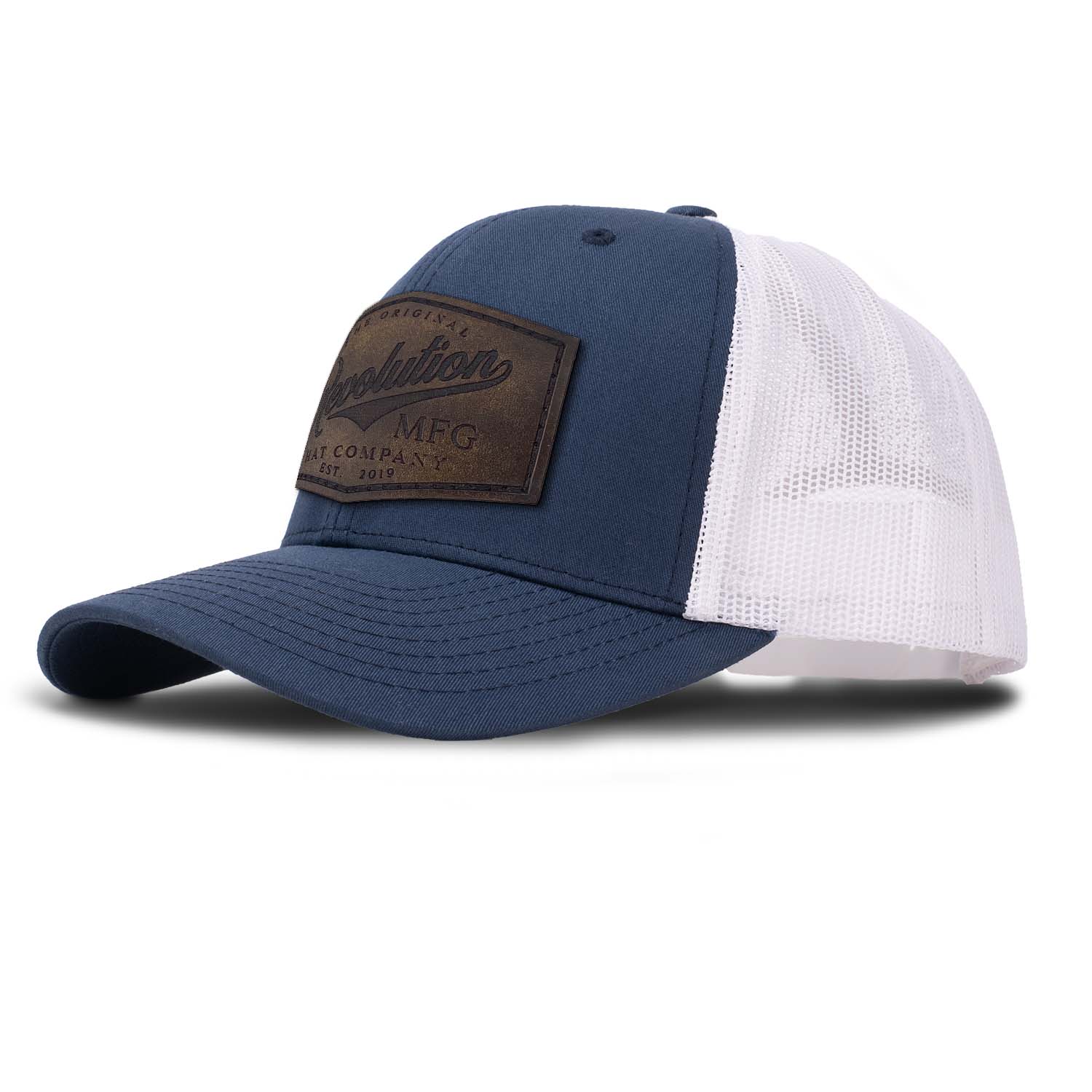 Revolution Mfg Hat Co full grain leather patch on a classic navy trucker hat with white mesh