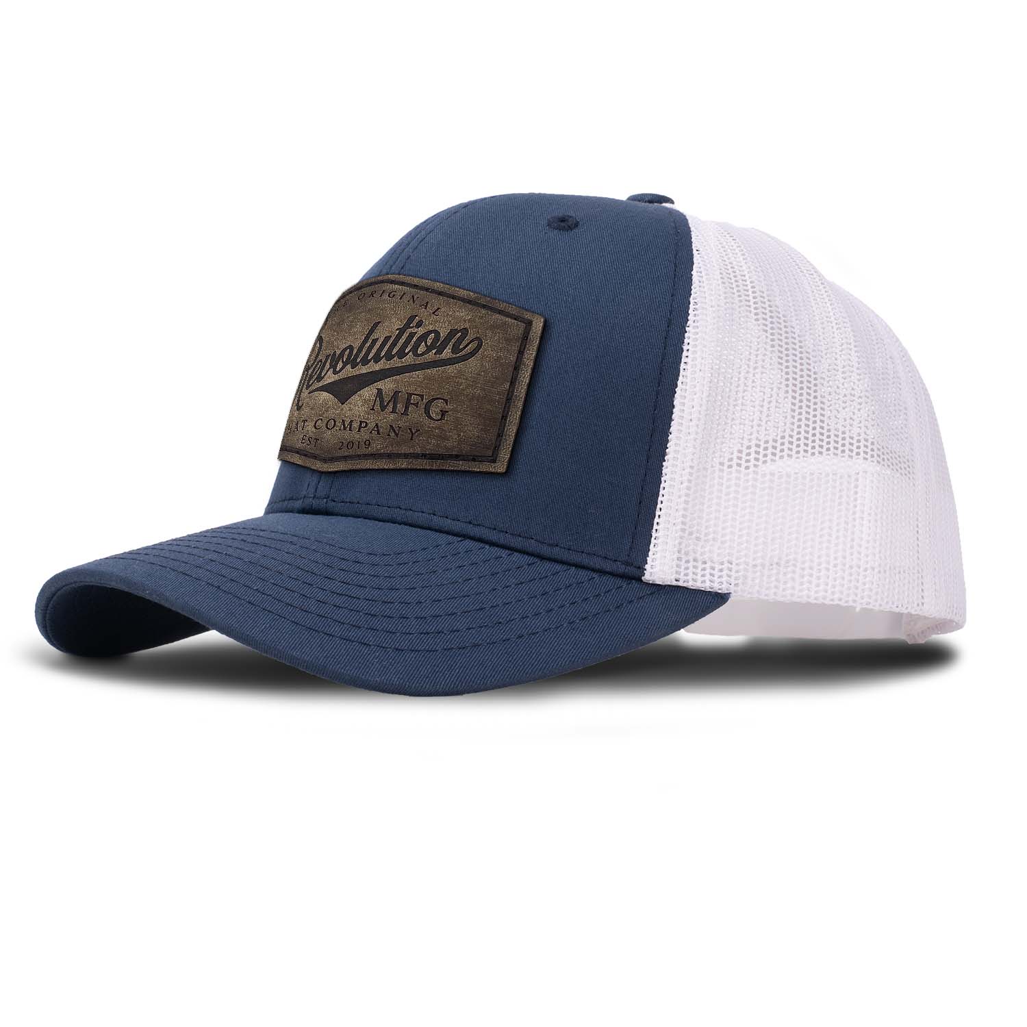 Revolution Hat Co full grain leather patch in a vintage finish on a navy with white mesh classic trucker hat