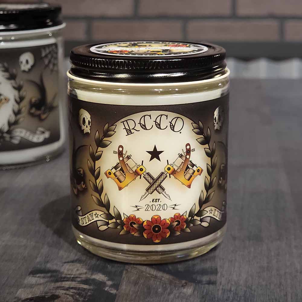 American Made Traditional Tattoo-inspired designs Tattoo Parlor masculine cologne type scent Soy blend candle Revolution Candle Co Red and Yellow flowers Skulls Traditional Sparrows Tattoo Machines crossed