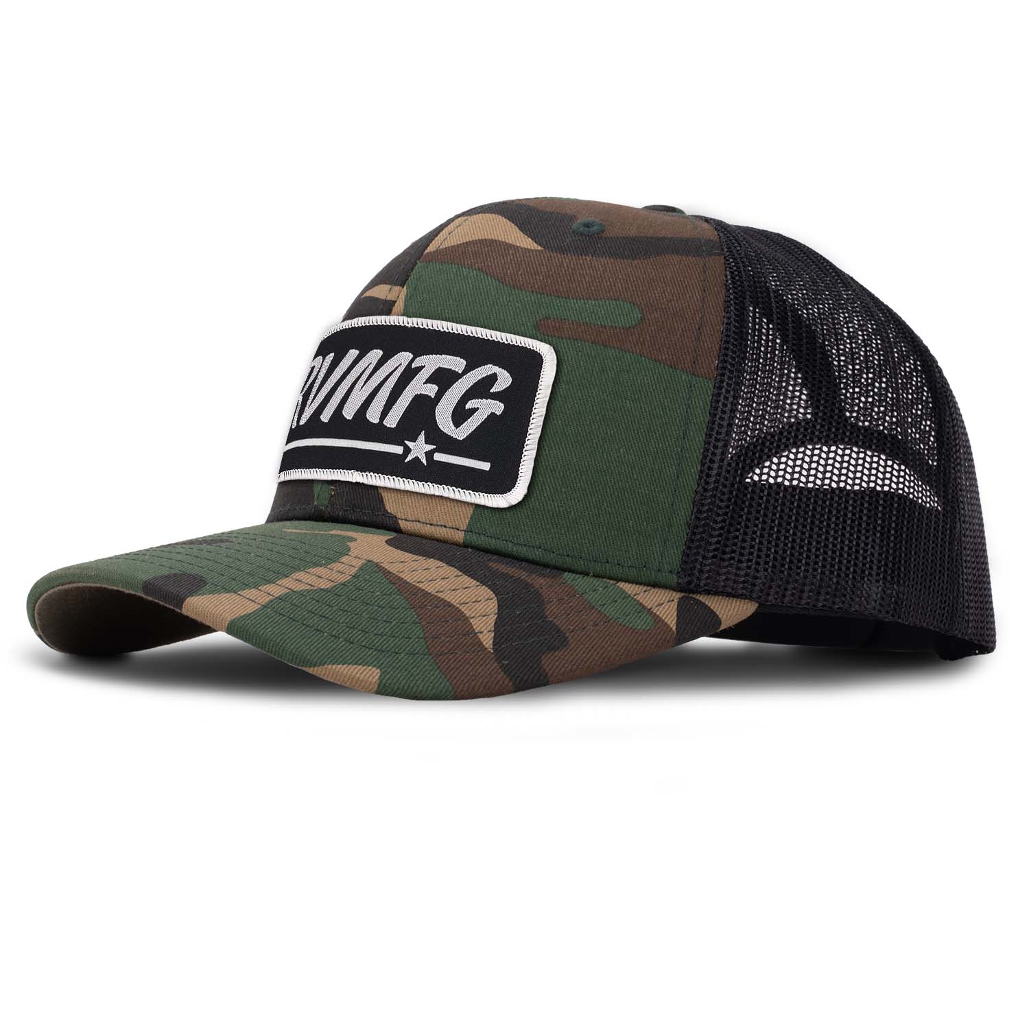 Revolution Mfg classic trucker hat in woodland camo with black mesh with a black woven RVMFG patch with white letters and a white border