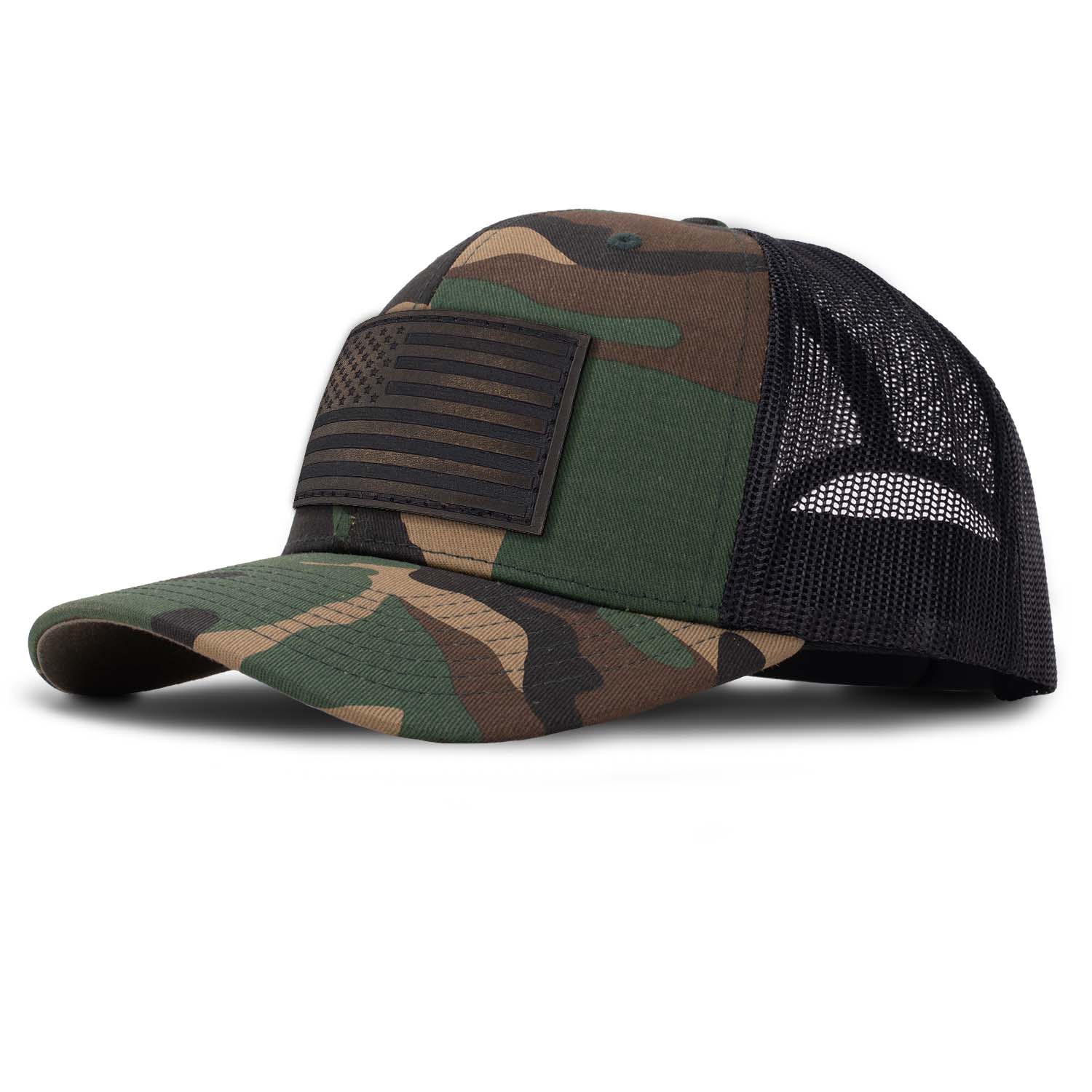 Revolution Mfg classic trucker hat in woodland camo with black mesh with a dark brown full grain leather American flag patch