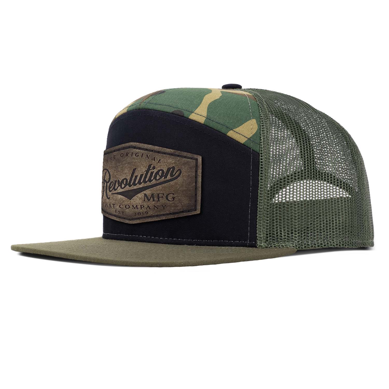 Revolution Hat Co Vintage full grain leather patch stitched on a black, woodland, and loden 7 panel flat bill trucker hat