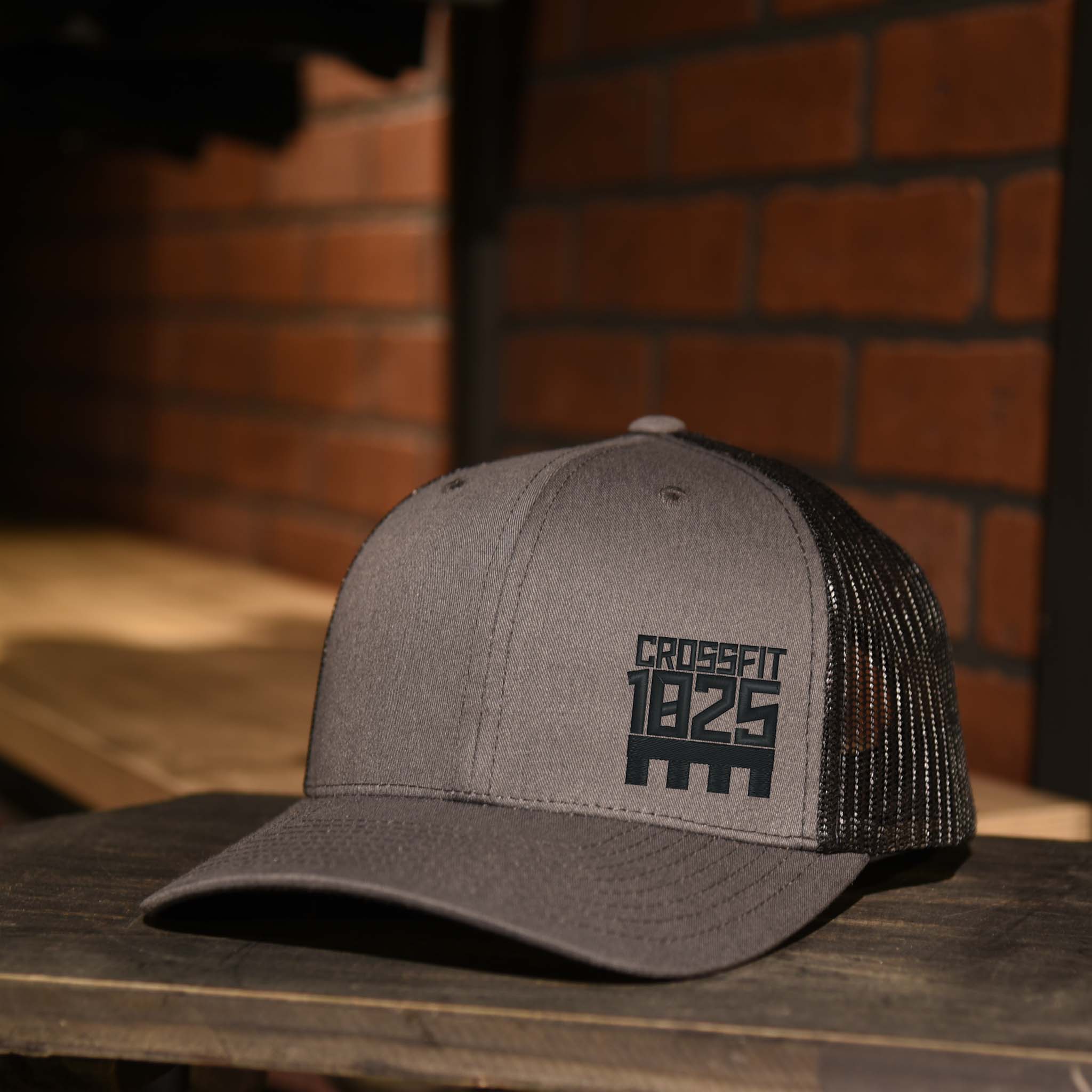 Charcoal and Black Trucker Hat with Crossfit 1825 Logo embroidered in black