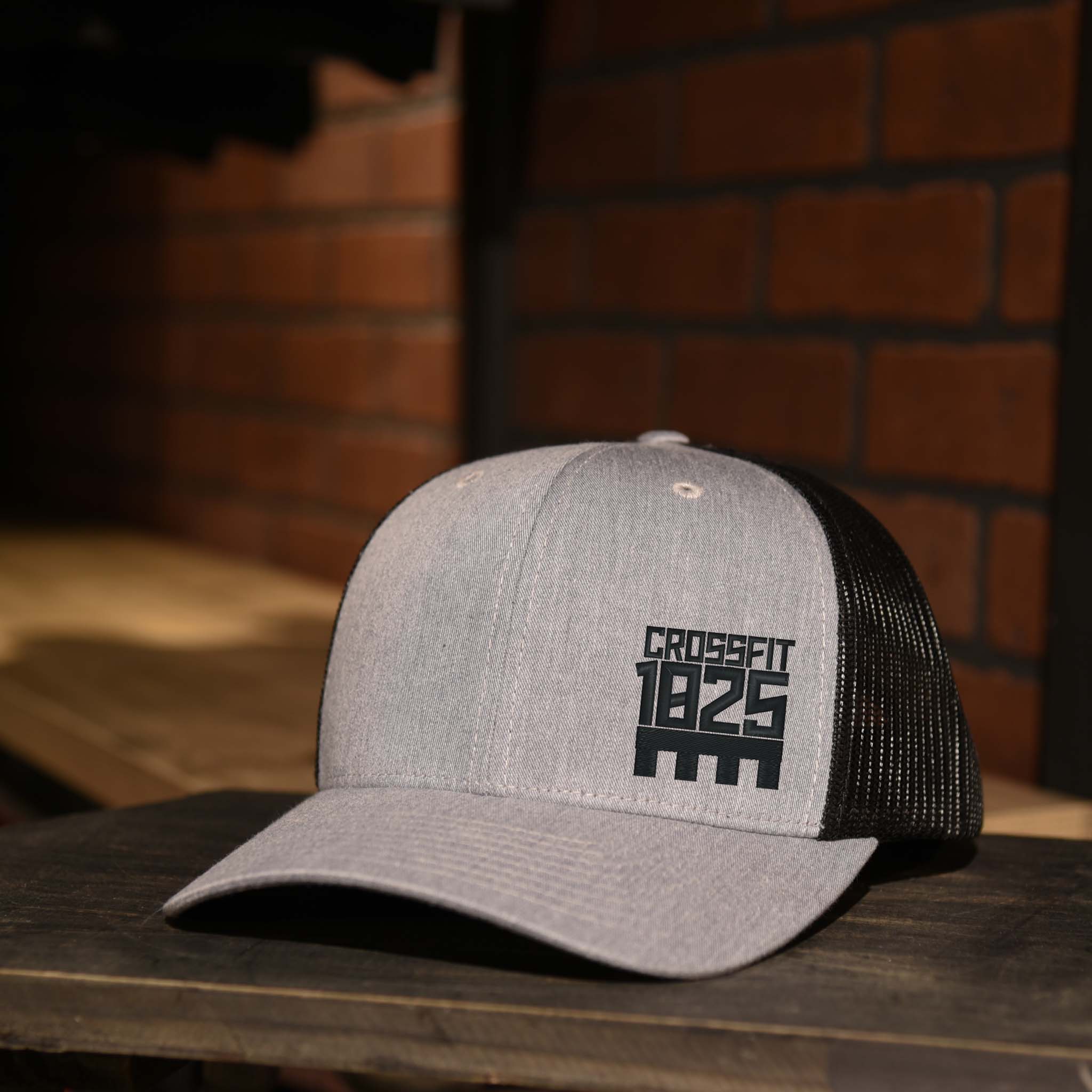 Heather Gray and Black Trucker Hat with Crossfit 1825 Logo embroidered in black