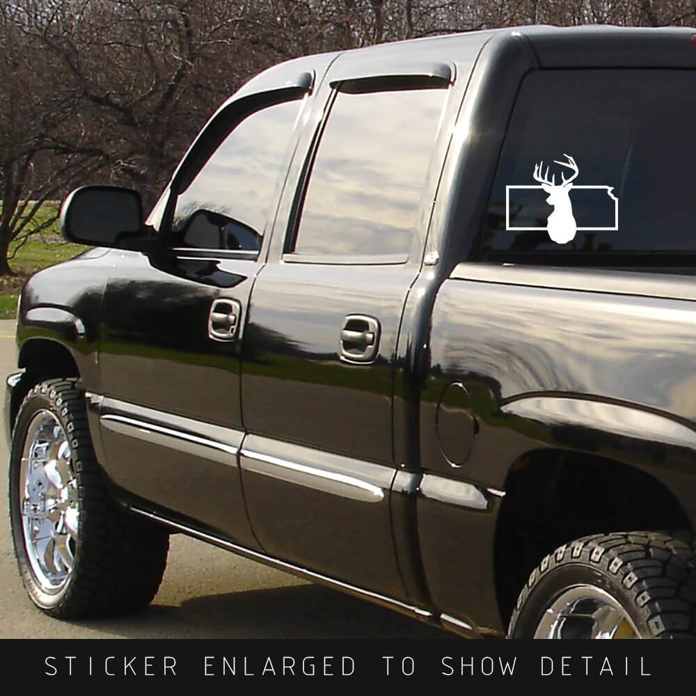 American Made die cut state outline white vinyl decal sticker Kansas with solid silhouette of deer head in the center shown on back window of black truck