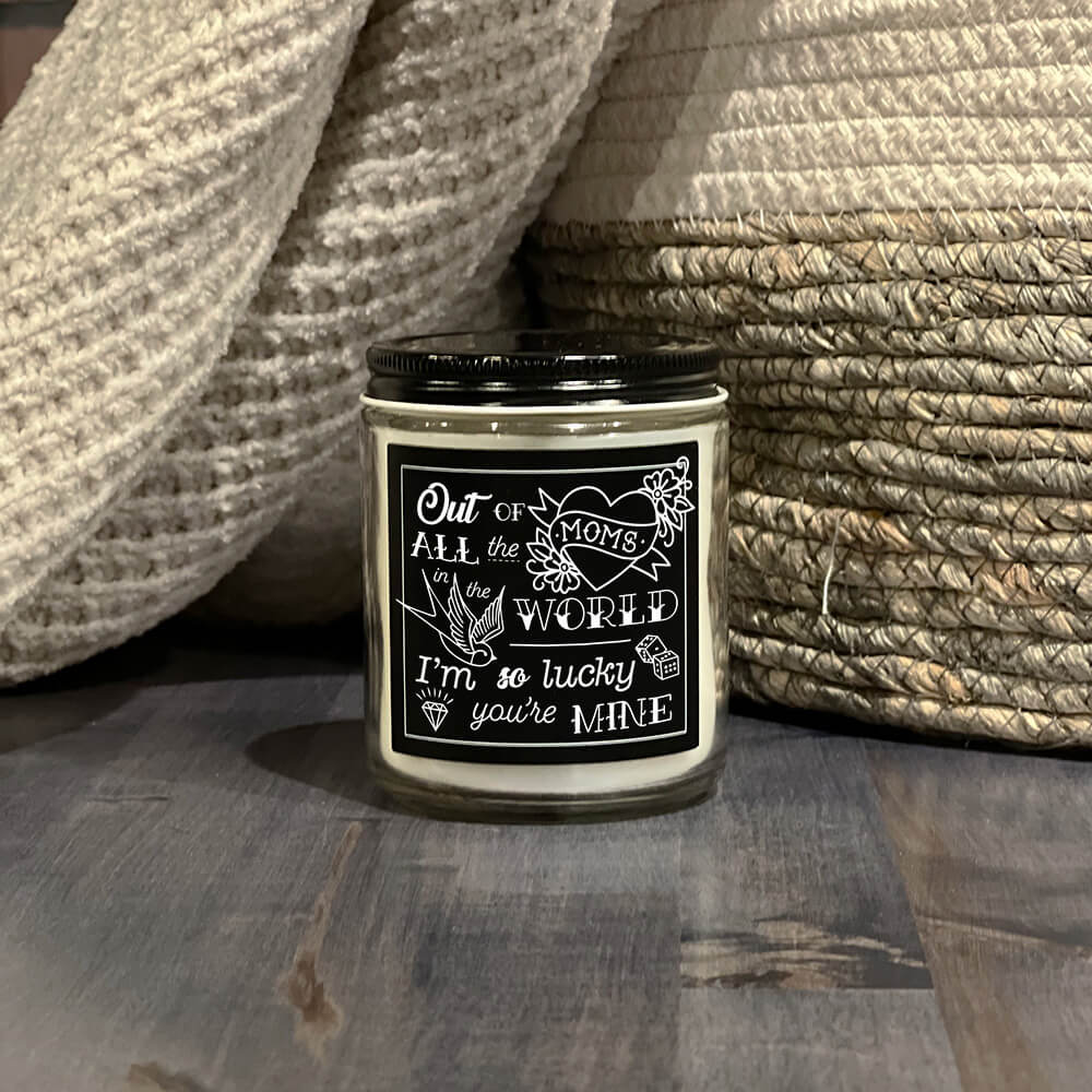 Mother's Day American Made Lucky You're My Mom candle black label with white tattoo inspired artwork and mixed font styles that read Out of all the moms in the world, I'm so lucky you're mine