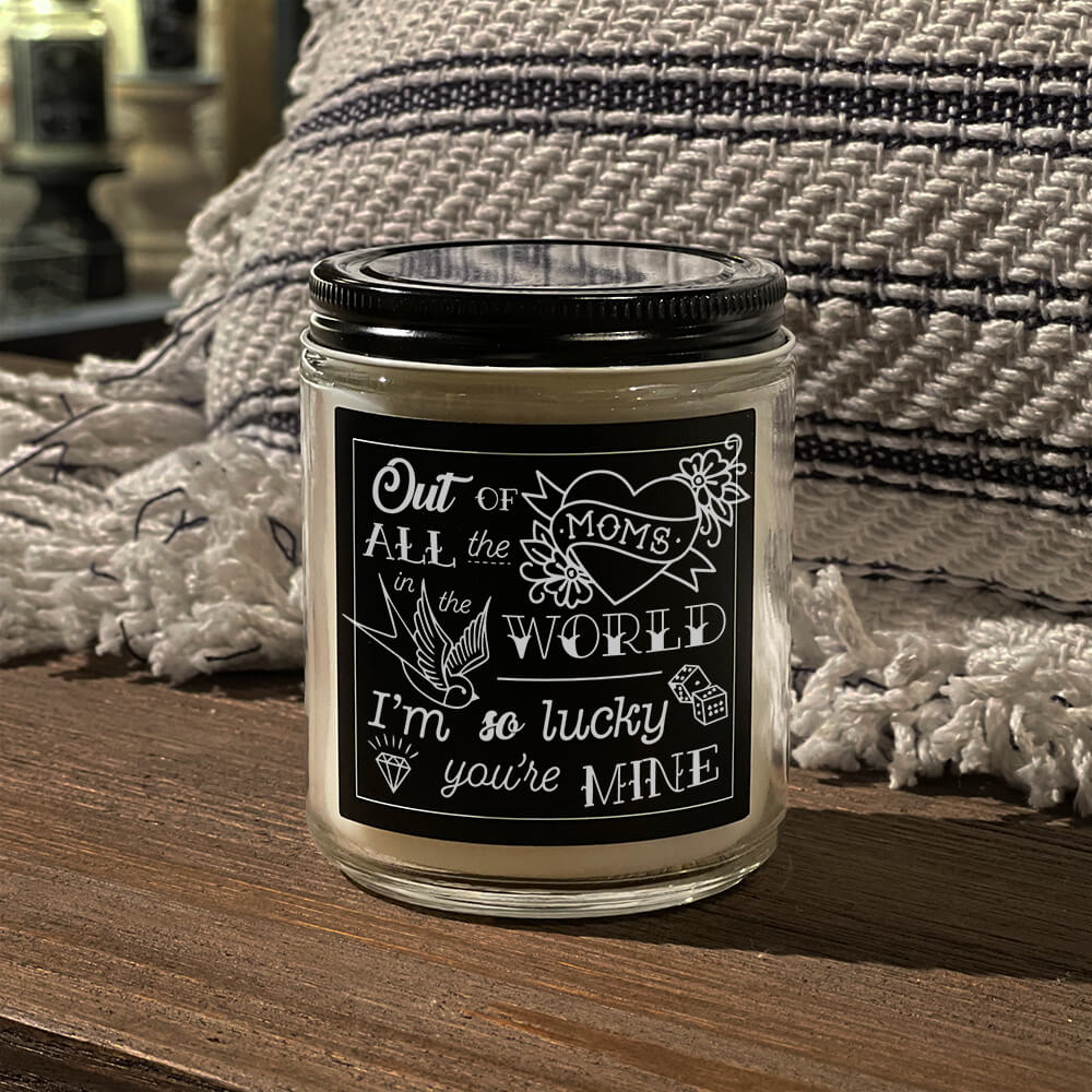 Mother's Day American Made Lucky You're My Mom candle black label with white tattoo inspired artwork and mixed font styles that reads Out of all the moms in the world, I'm so lucky you're mine