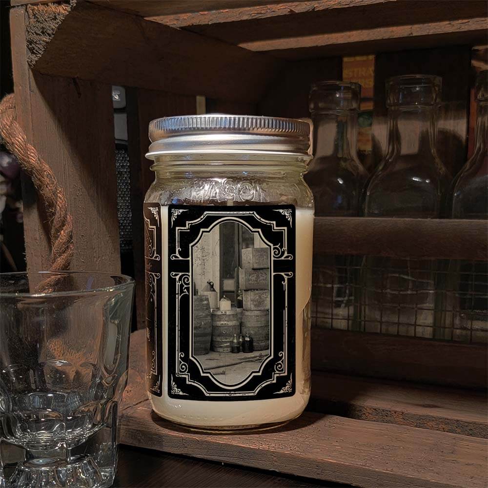 16oz Mason Jar Vintage Collection Candle - Moonshiner scent - Handcrafted in the USA-Prohibition Era inspired designs-side image moonshine in crates and jugs